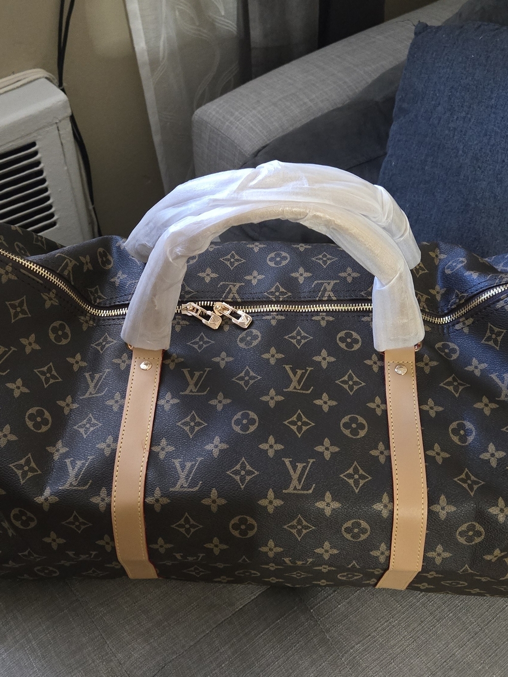 Louis Vuitton Monogram Duffel Bag in Brown with Tan Handles